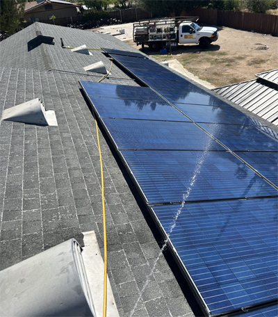 Solar panel cleaning on residential roof