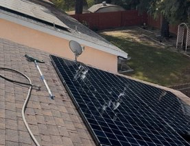 Solar panel cleaning on tile roof